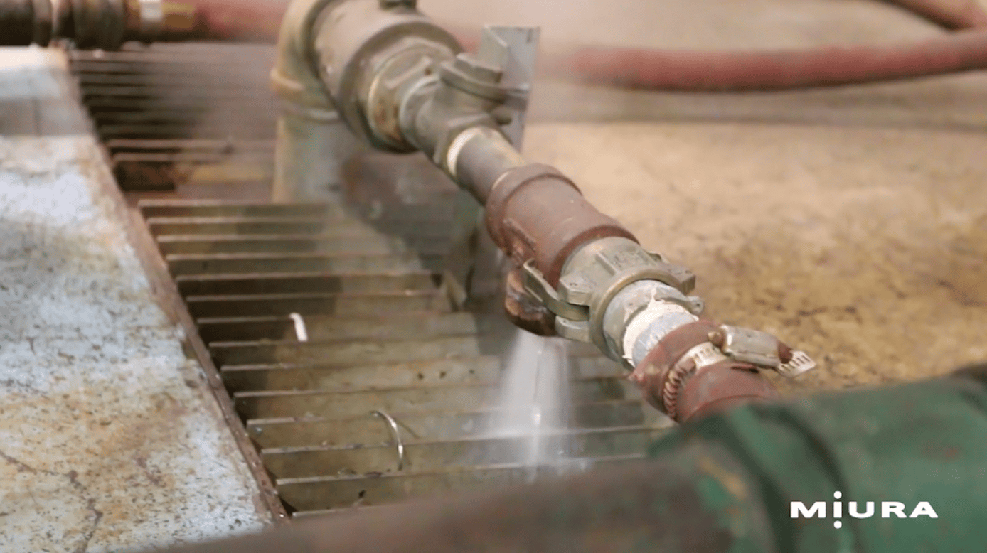 This image shows water being released through an open valve into a drain system